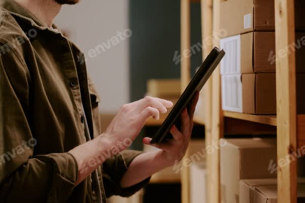 Warehouse team checking inventory on a tablet during order fulfillment