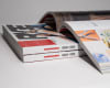 stack of perfect bound magazines with a open magazine