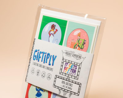 Kit with post cards and other merchandise in a cellophane bag