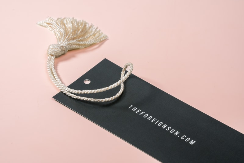 Black bookmark with white tassel