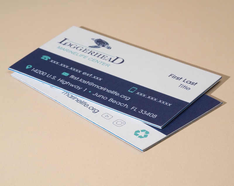 Two real estate business cards