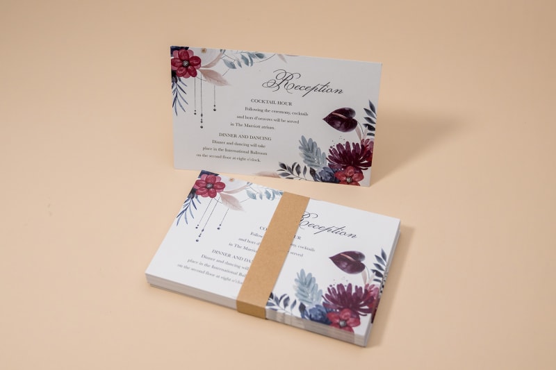 Stack of reception cards with belly band and one card standing up