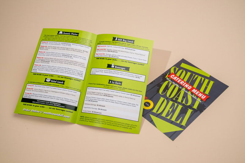 One open and one closed South Coast Deli menu brochure