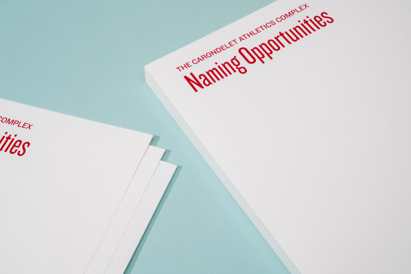 Closeup of corners of two stacks of school letterheads