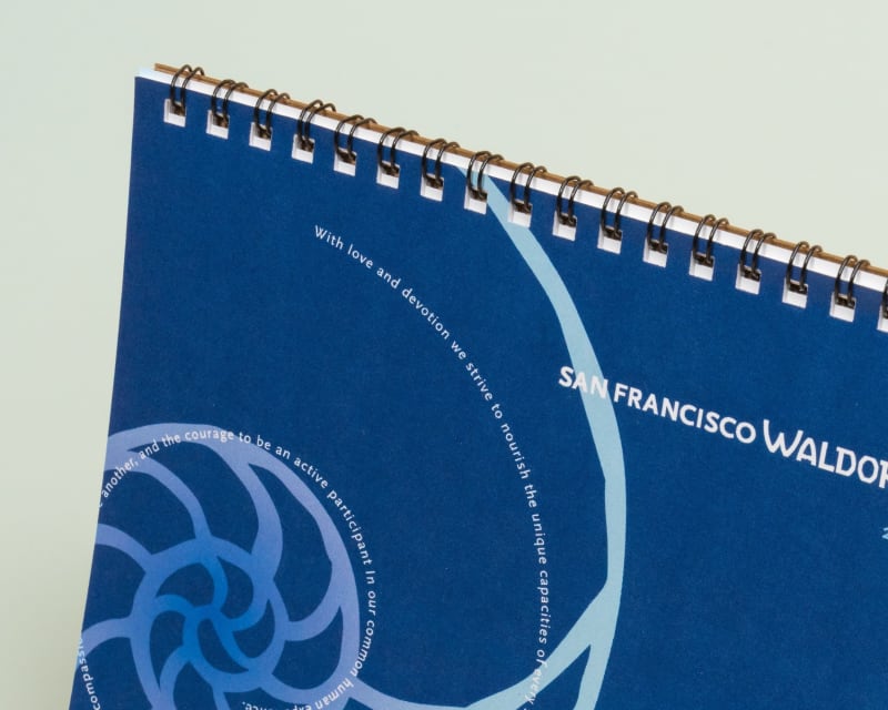 Closeup of wire-o binding on a blue calendar