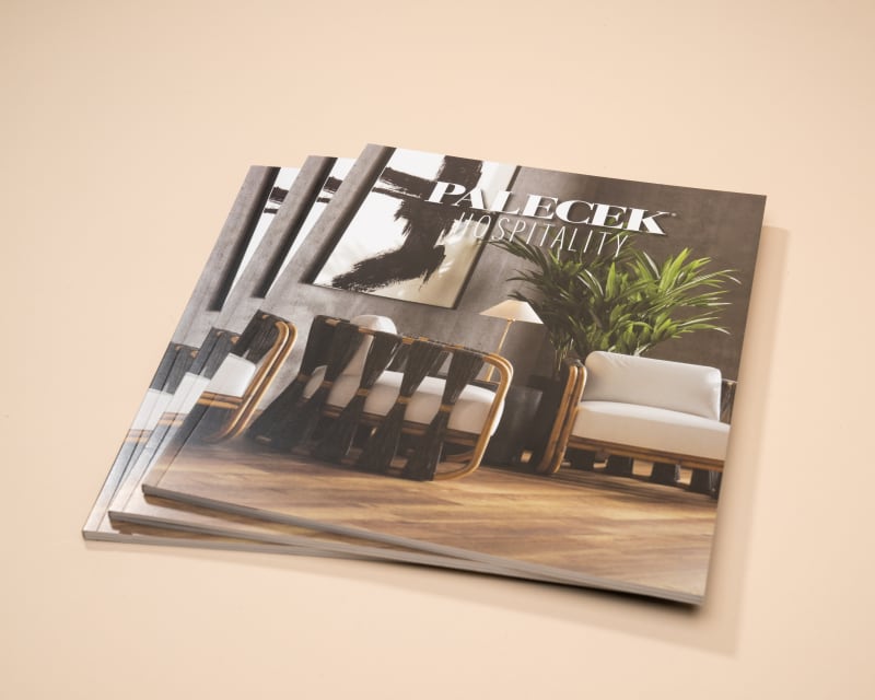 three perfect bound books stacked together