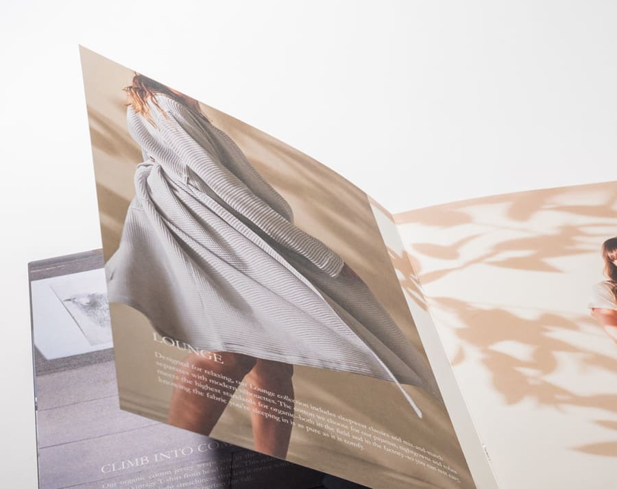 Saddle-stitched booklet with pages fanned open