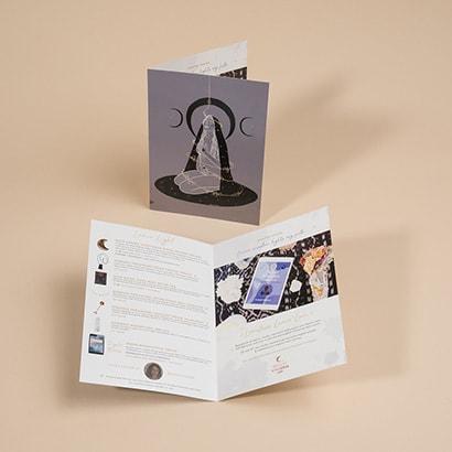 One open bi-folded brochure and one closed bi-folded brochure 