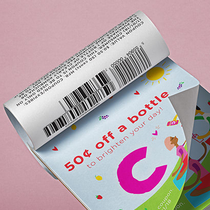 Coupon booklet with page turned revealing barcode
