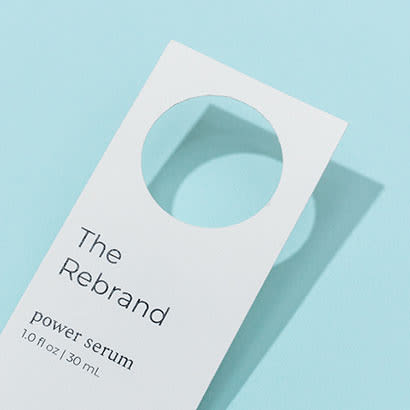 The Rebrand custom-shaped hang tag