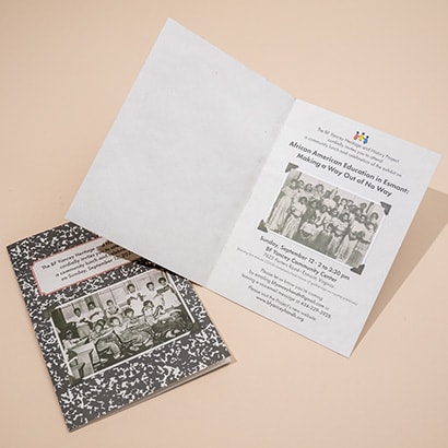 Half fold non profit invitation opened on top of closed invitation