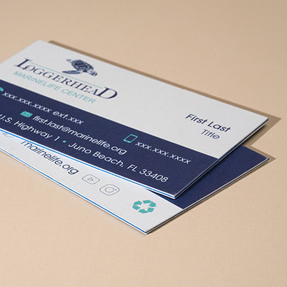 Two real estate business cards