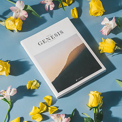 Genesis booklet surrounded by flowers