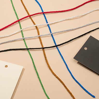 Colorful strings arranged with black and white hang tags