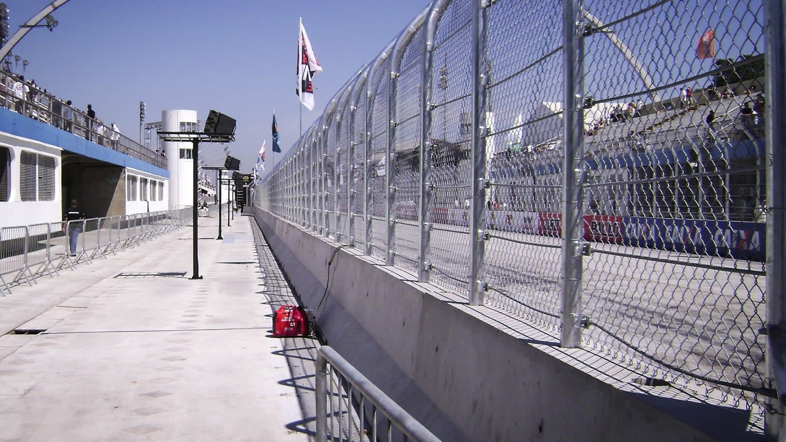 formula one car driving fast on a street circuit with concrete barriers (file image)