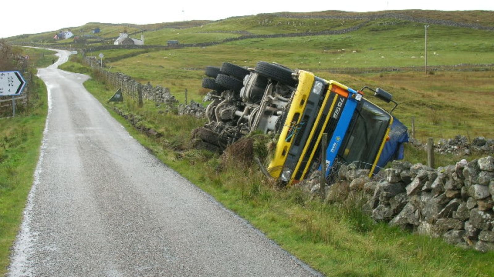 overturned police vehicle on a rural road (file image)