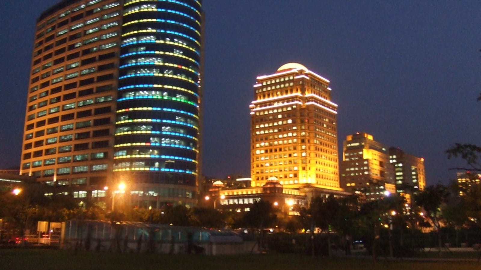 a modern glass corporate office building in pune reflecting the blue sky (file image)