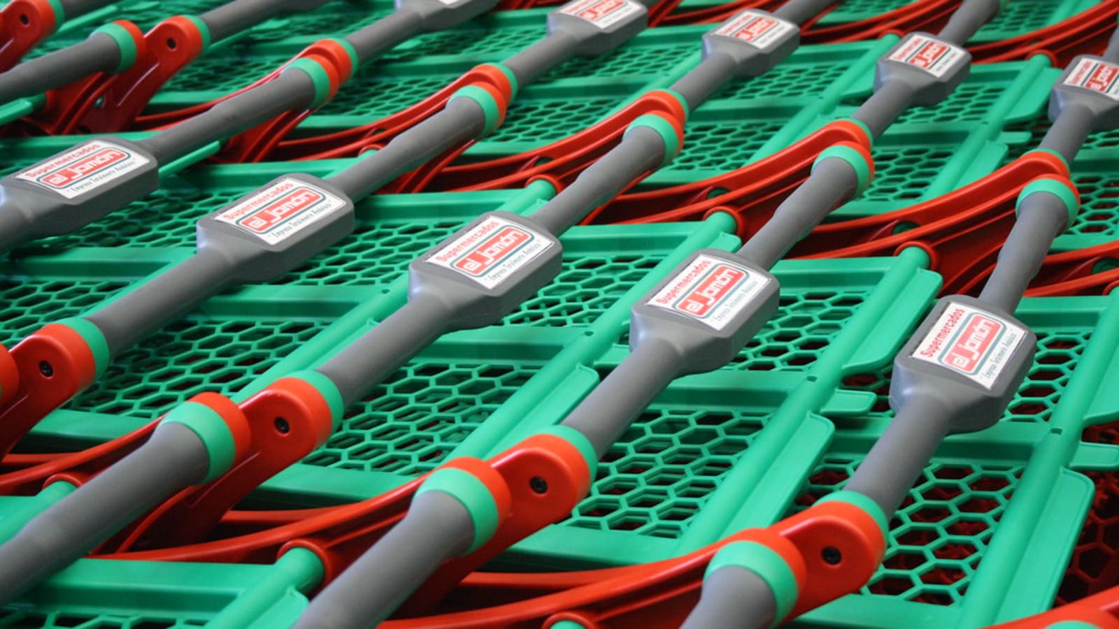 shoppers with trolleys walking through supermarket aisles (file image)