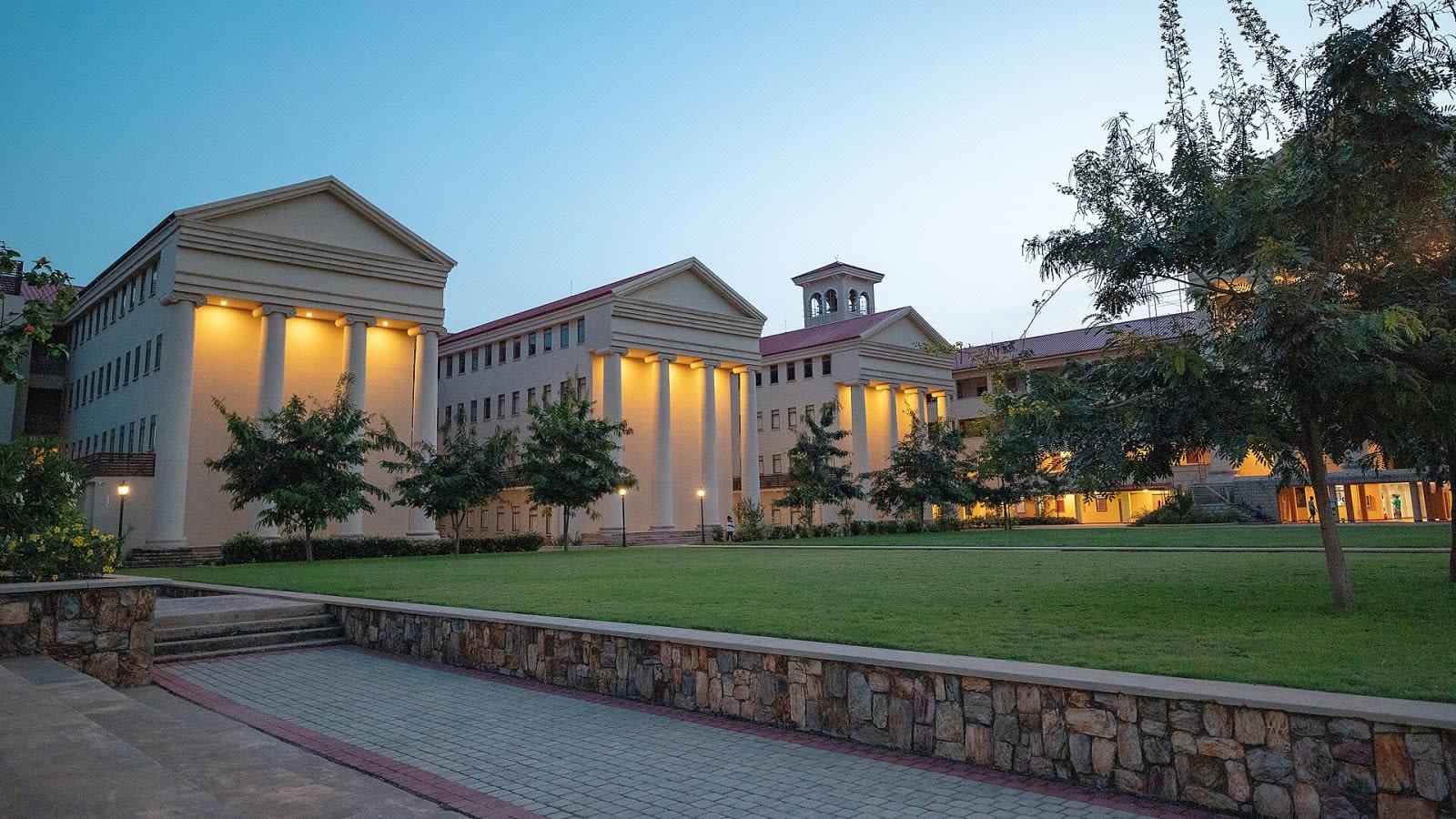 modern university campus building exterior with clean glass and concrete (file image)