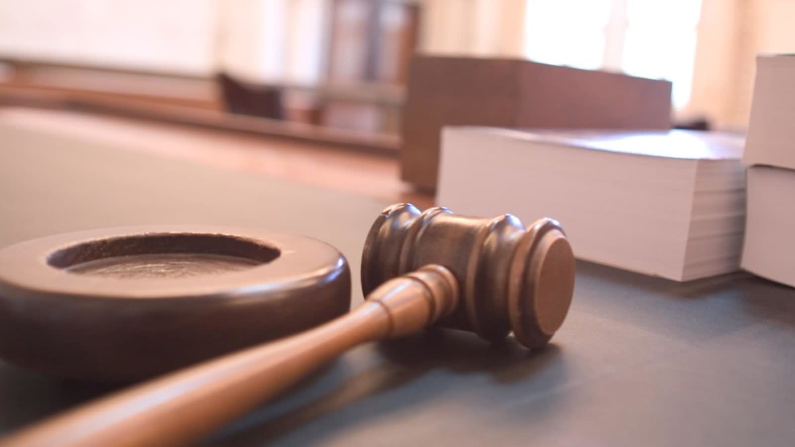 gavel resting on wooden courtroom bench (file image)