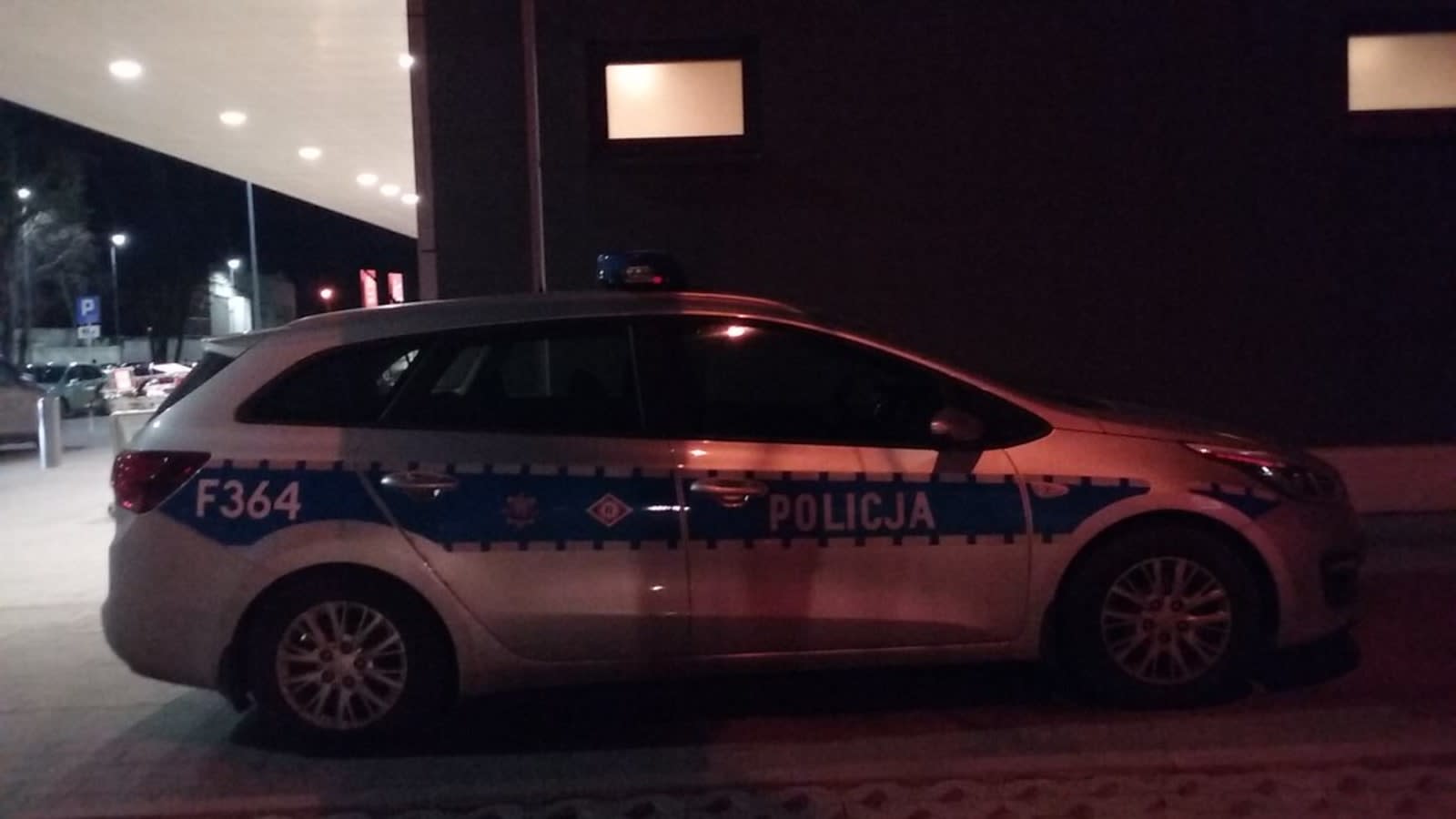 police car outside a modern european school building (file image)