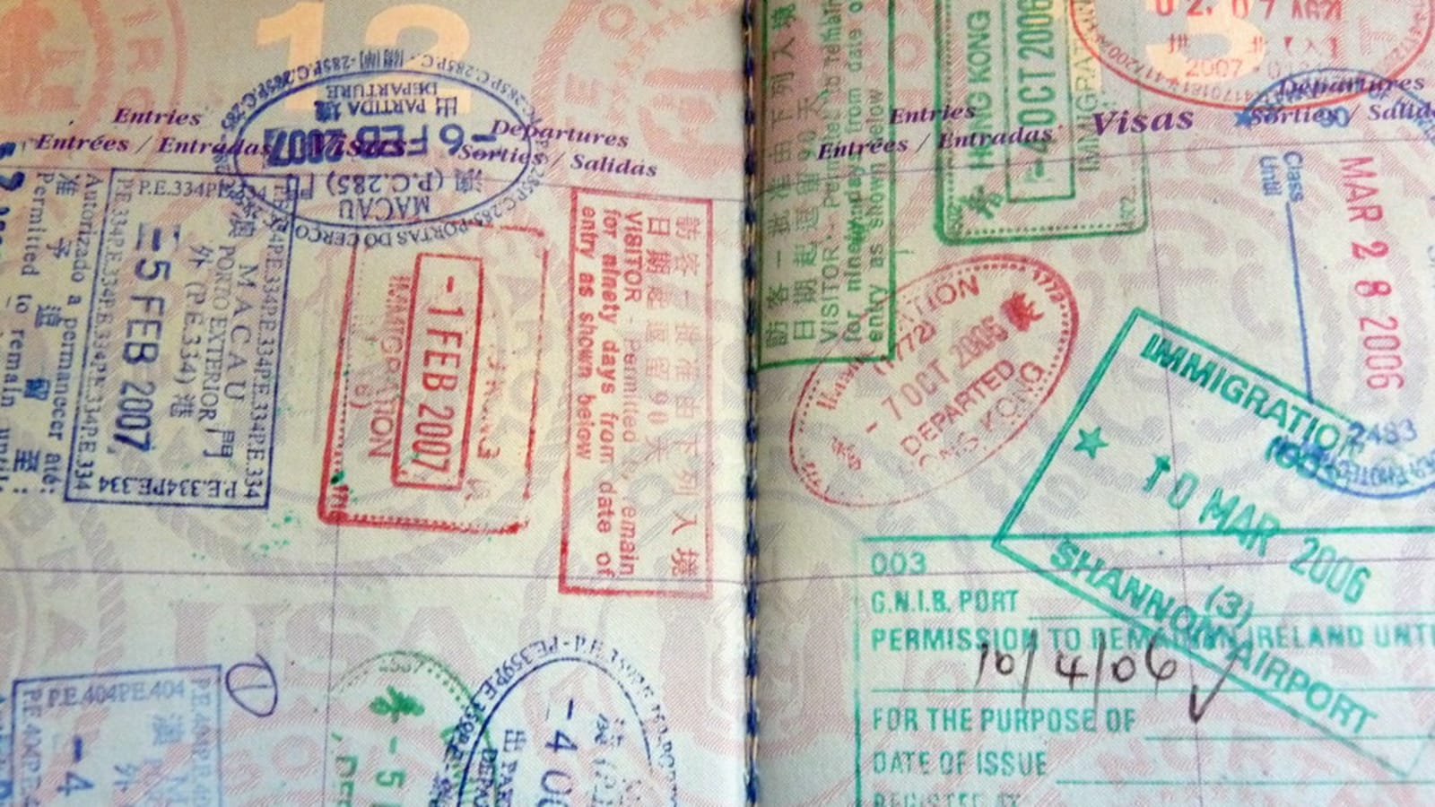 close up of a visa stamp inside a passport on a wooden desk (file image)