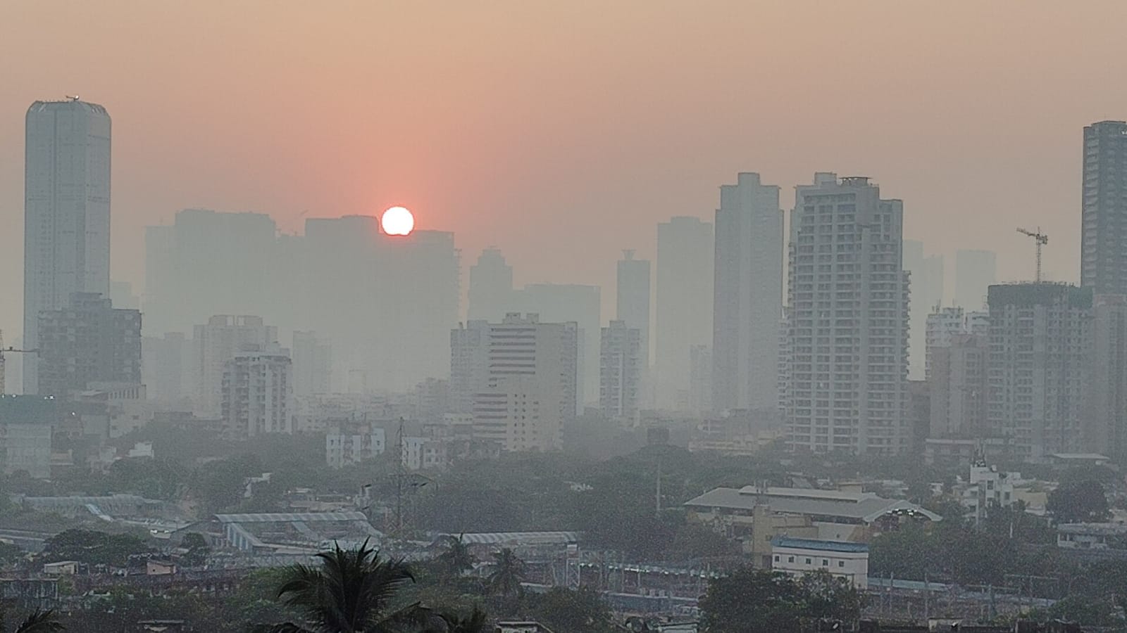 hazy sun shining over mumbai high-rise buildings (file image)