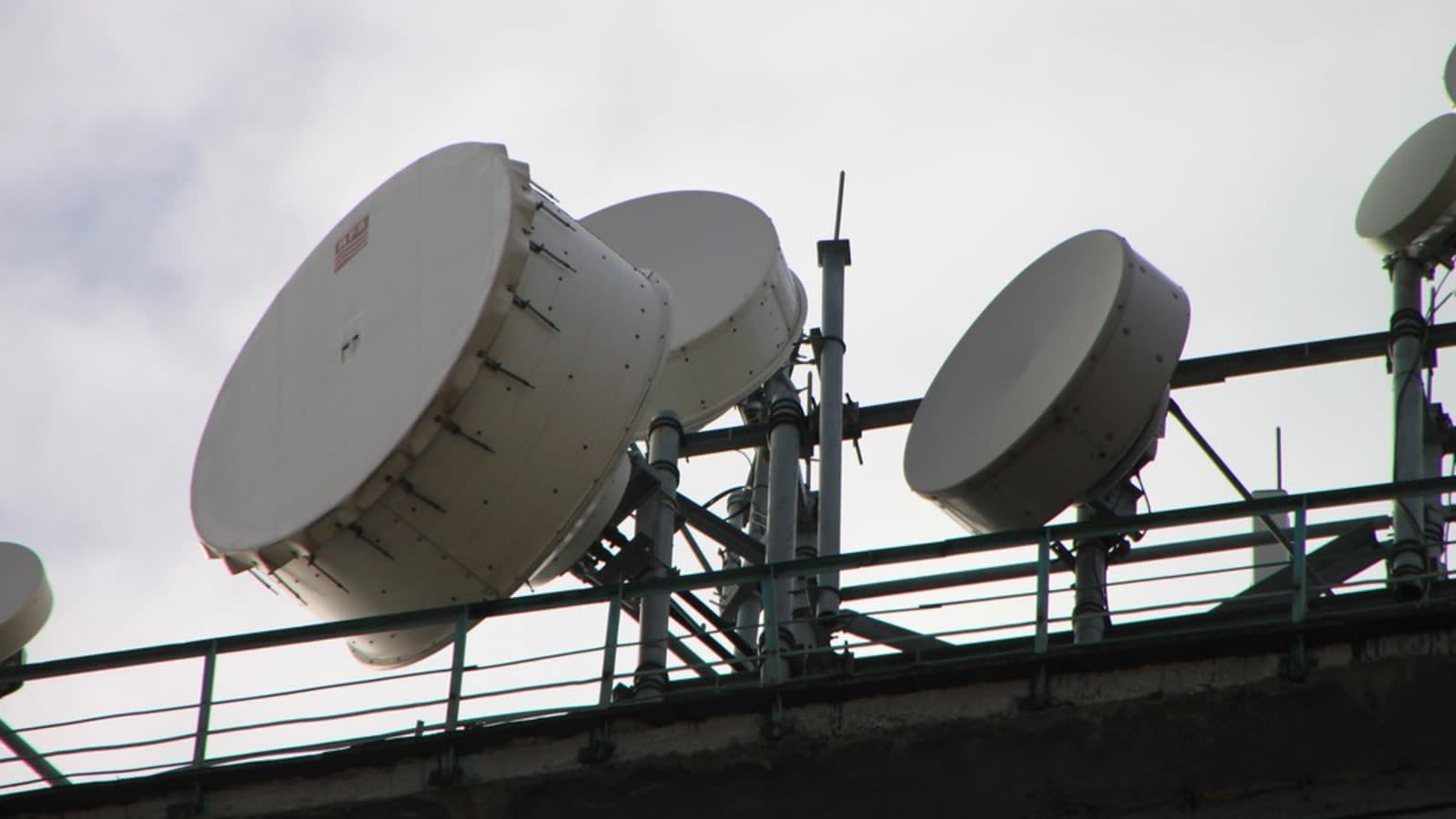 a modern telecommunications satellite ground station dish pointing towards the sky (file image)