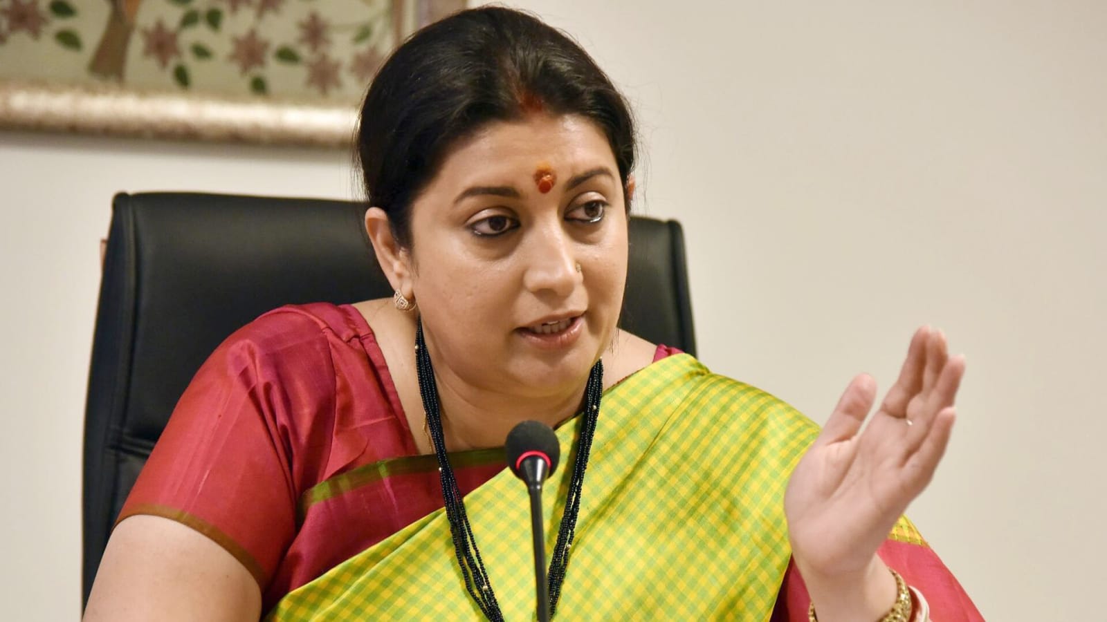Smriti Irani addressing media on governance reforms in New Delhi.