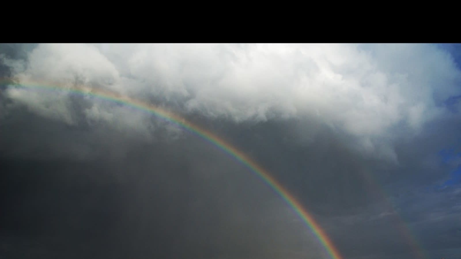 Rainbow over Hyderabad skyline signals relief after prolonged dry spell.