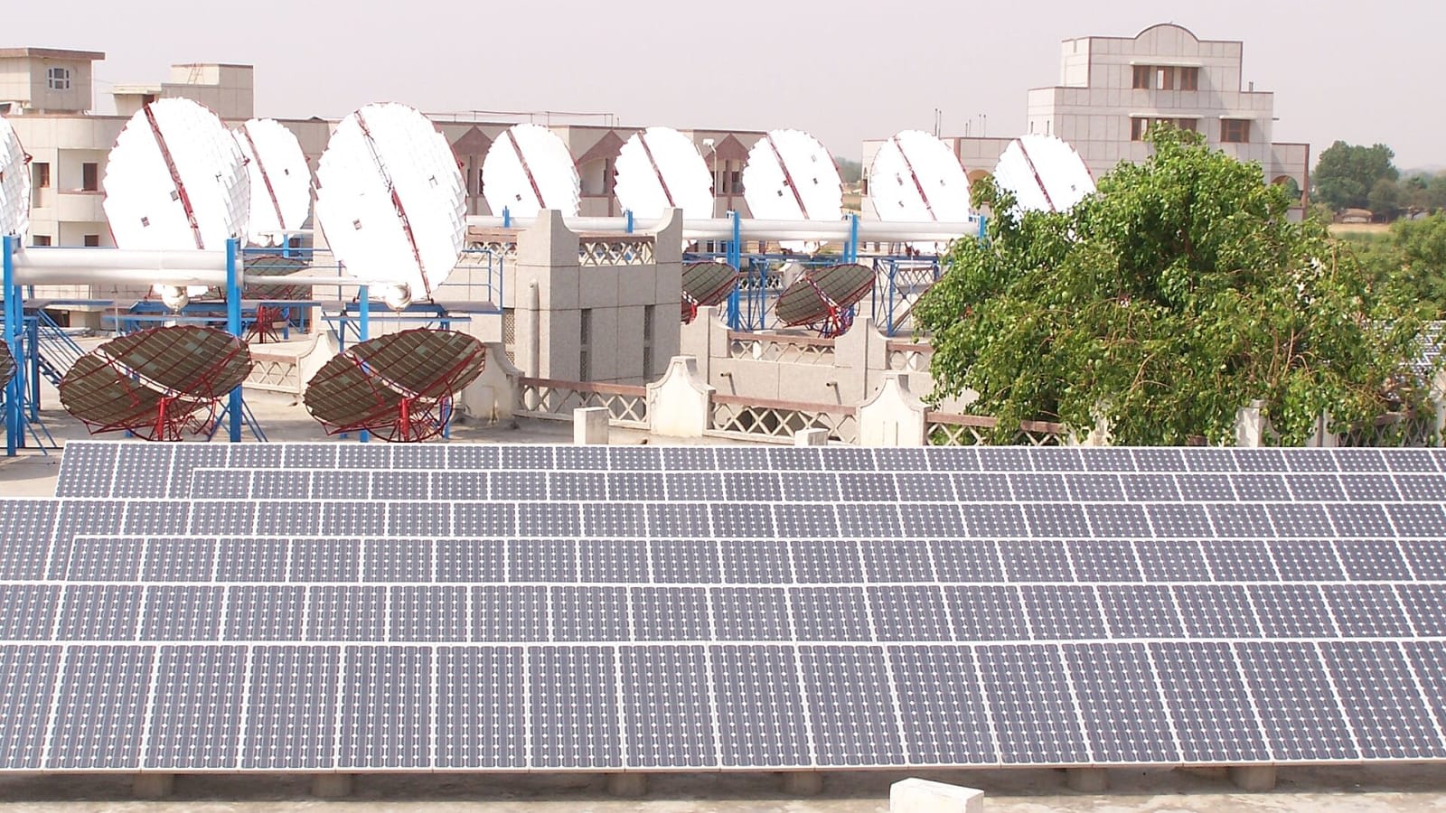 Solar panels at a power plant in India, reflecting domestic clean energy growth.