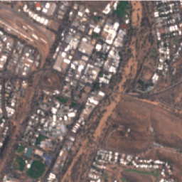 Can Location Embeddings Enhance Super-Resolution of Satellite Imagery?