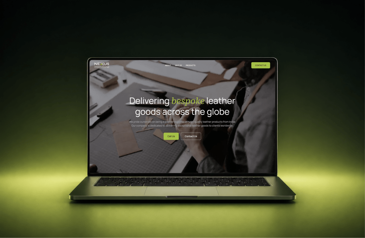 Nexus International website shown on a laptop