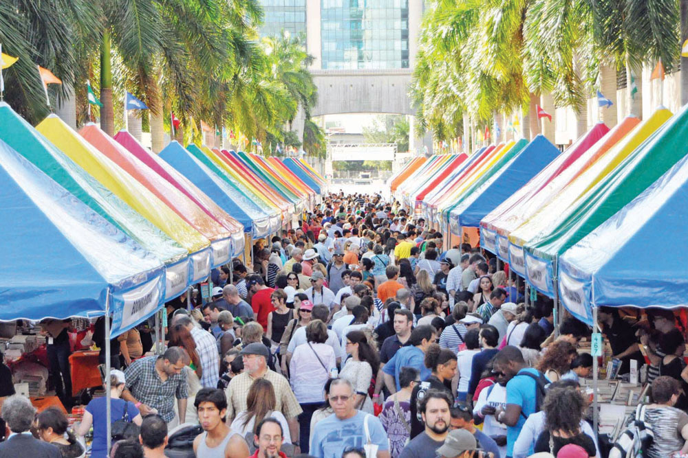 A street fair with a large crowd of people