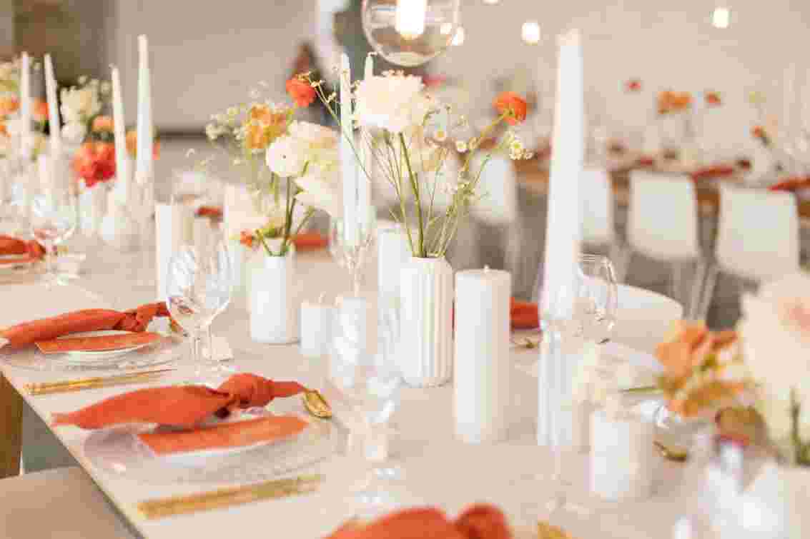 Elegant table setting with candles and blush tones
