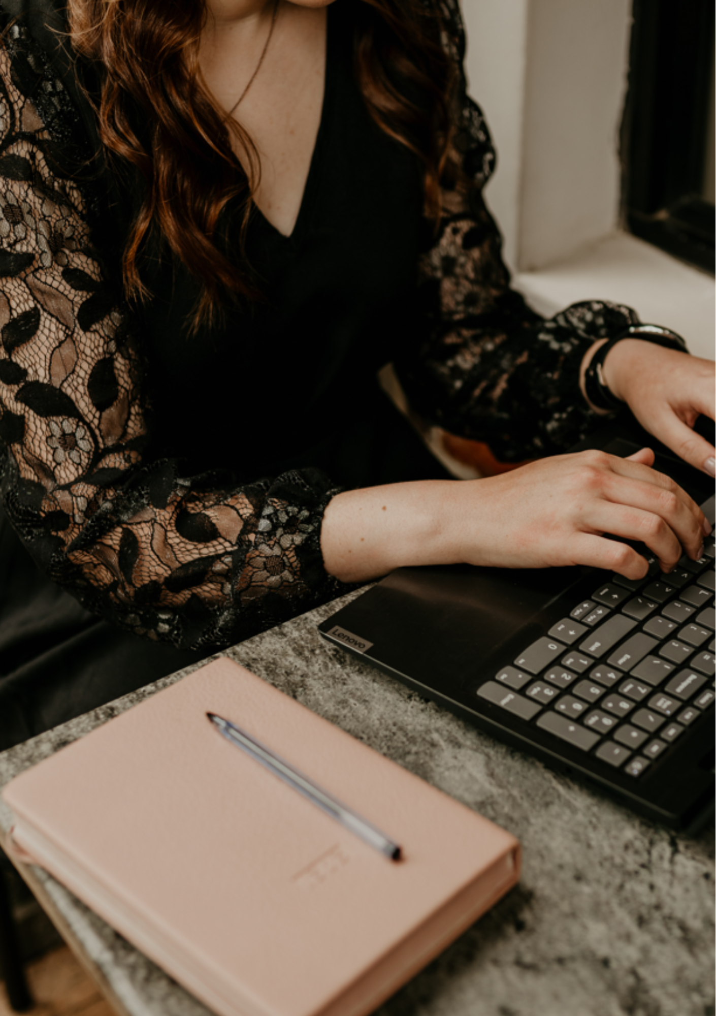 Planner writing in notebook