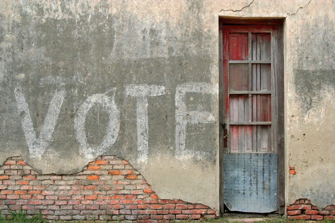Vote written on concrete wall