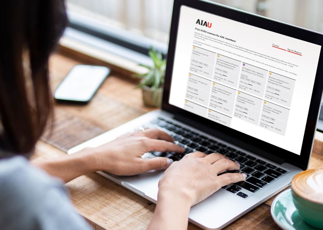 person taking an AIAU course online