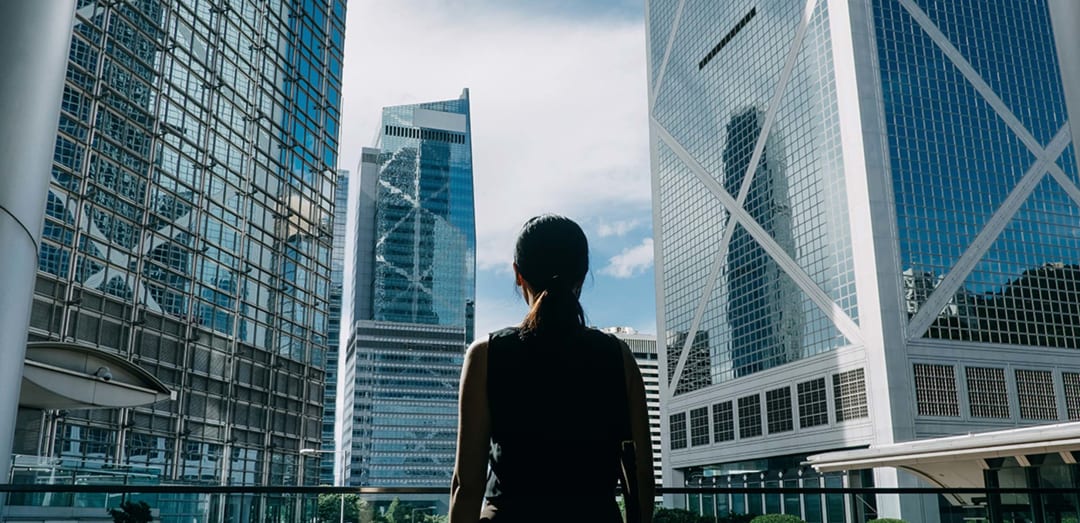 Females gazes toward buildings in city