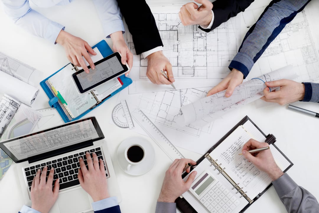 Business-people-discussing-development-project-825874766_6278x4186 (1) Deltek landing image