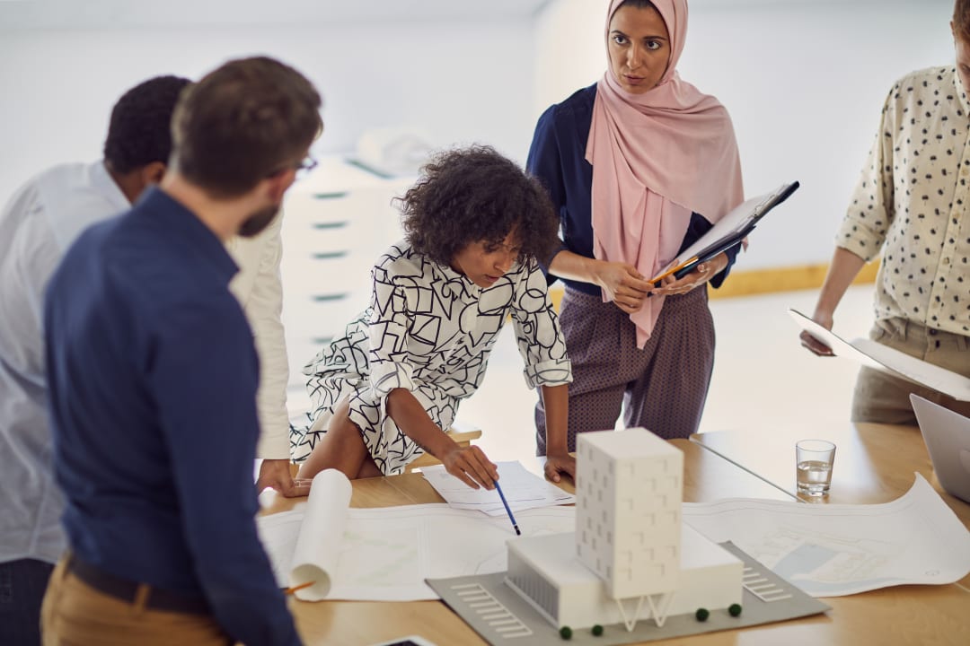 group of diverse colleagues working on a project