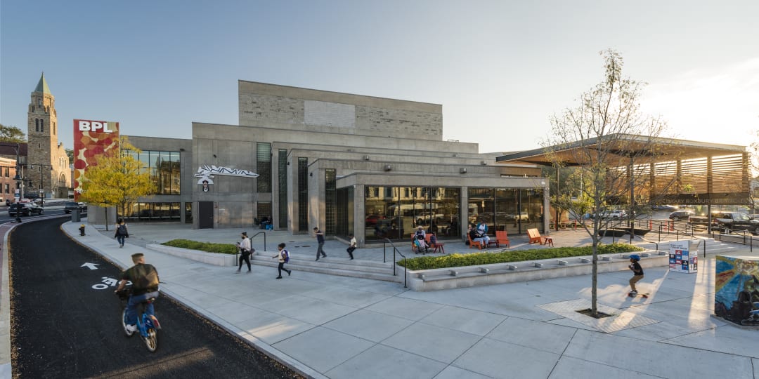 OUTSIDE COURTYARD OF ROXBURY LIBRARY WITH RESIDENTS AND BIKE PATH