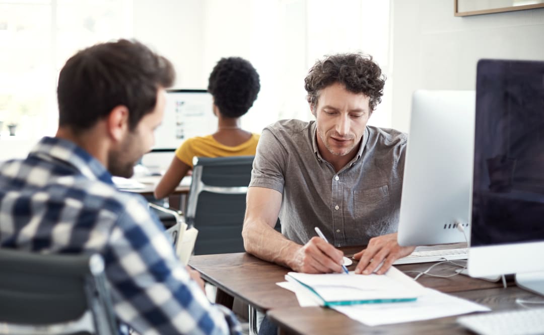 Three people working on a project
