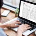 person taking an AIAU course online