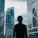 Females gazes toward buildings in city