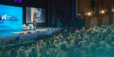 Woman speaking on stage at WLS