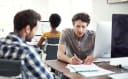 Three people working on a project