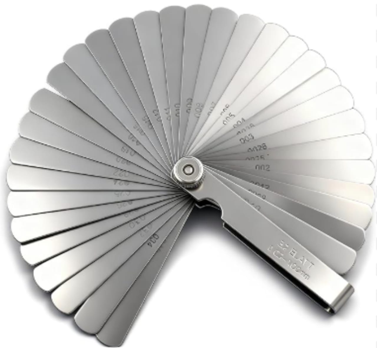 Feeler gauge blades checking valve clearance on an engine