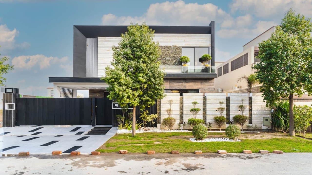 Minimalist modern house design in Pakistan — clean lines, neutral palette, large windows