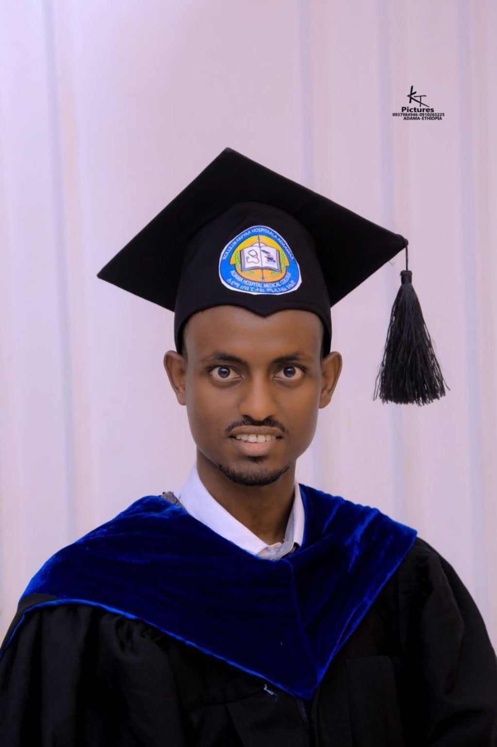 Founder Mohammed Mersha Assefa smiling, in front of clinic
